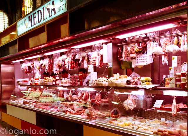 A butcher in the market of Malaga, Spain