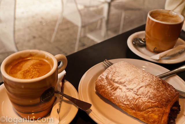 Two cups of Café con leche and a pain au chocolat in Malaga, Spain